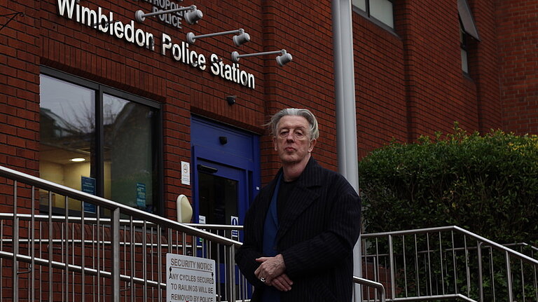 Paul outside police station